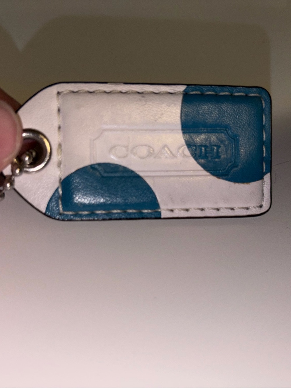 COACH White Leather Polka Dot Hang Tag with Teal Accents